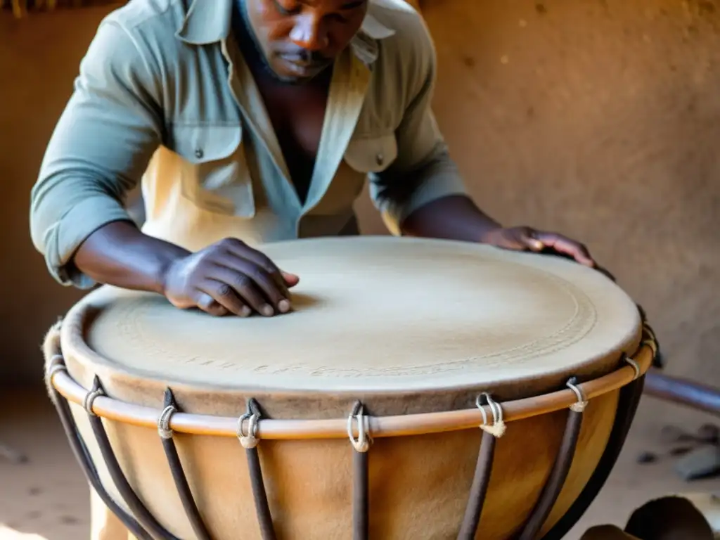 Un artesano africano fabrica ritualmente un tambor africano, mostrando la meticulosidad y la artesanía centenaria