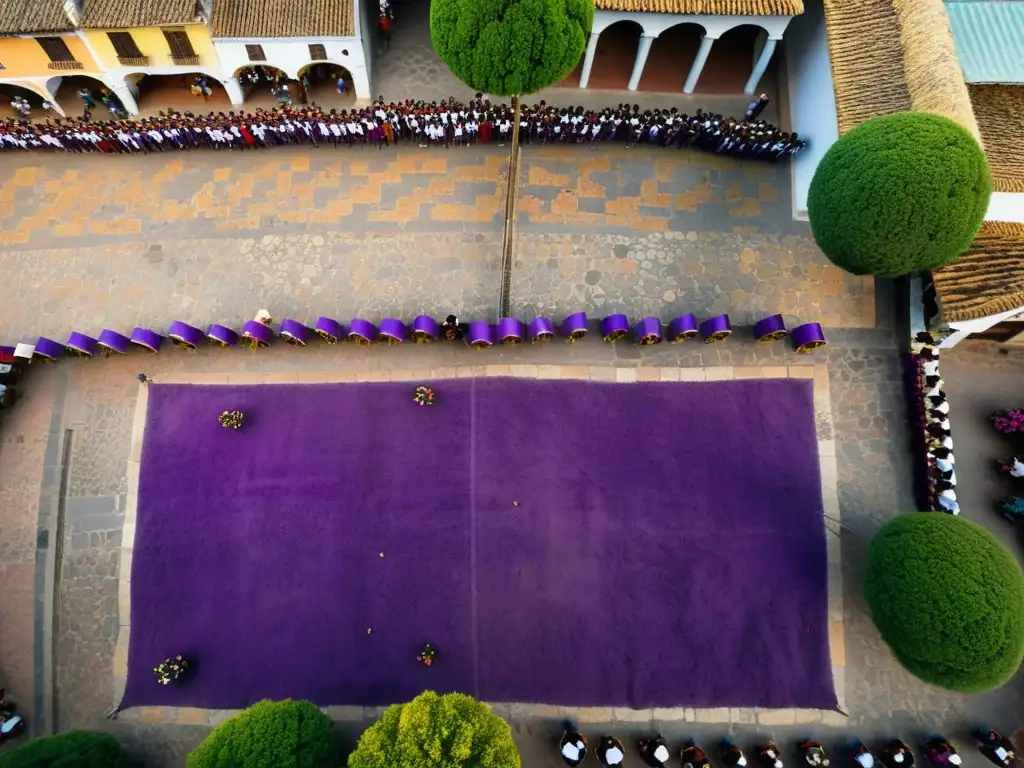 Vista aérea de las calles empedradas de Antigua Guatemala durante los Ritos de Semana Santa, con alfombras de aserrín y procesiones religiosas